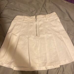 White pleated skirt with zipper and belt loops